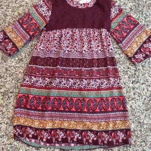 Red patterned tunic.